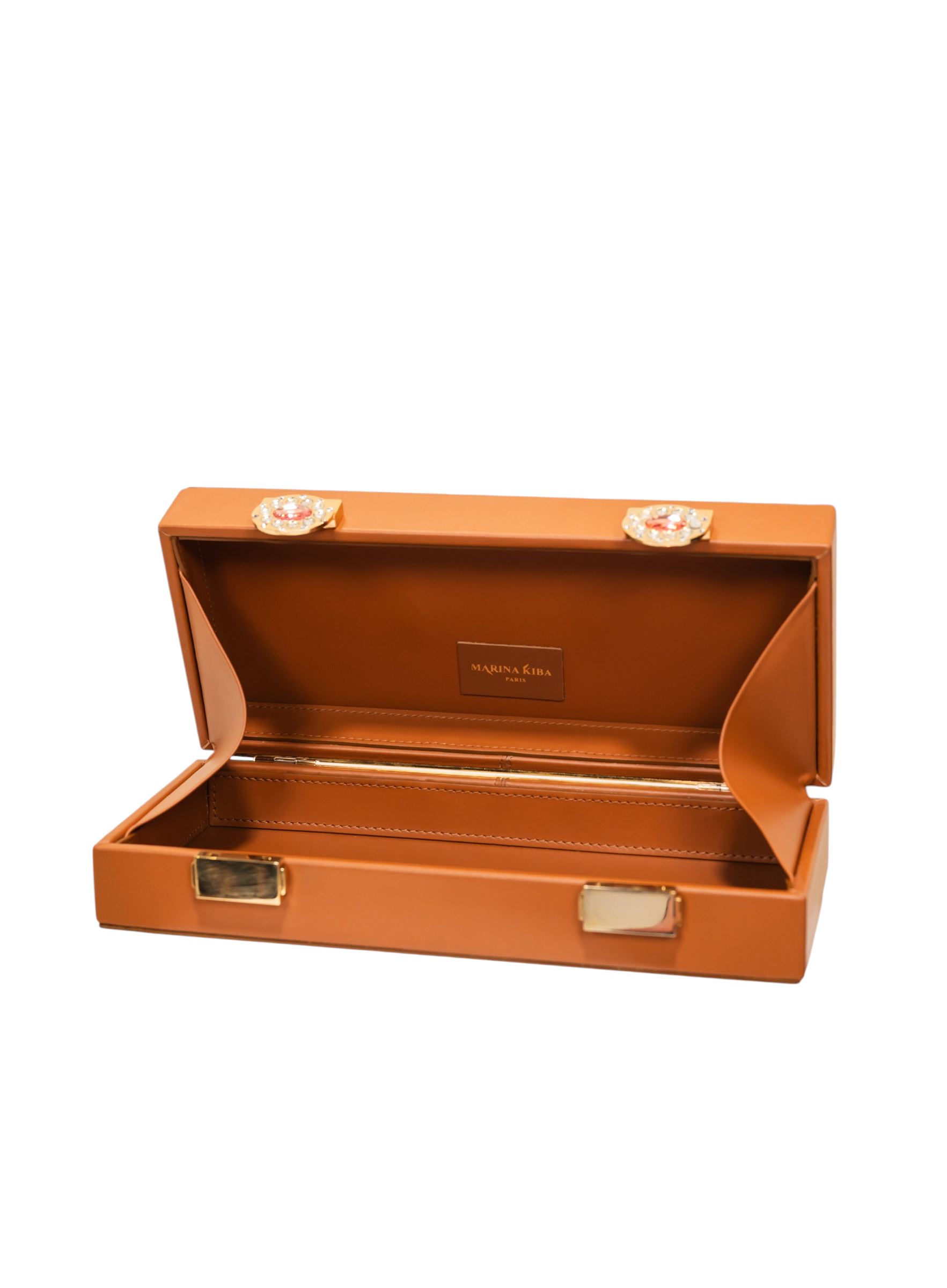 Sac en cuir caramel élégant avec détails dorés et design architectural